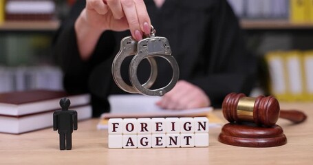 Tense courtroom scene highlighting foreign agent accusations and the gravity of justice