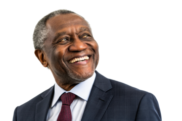 Joyful Black businessman in a suit smiles broadly looking up and to the side, perfect for corporate communications, diversity, and success themes.