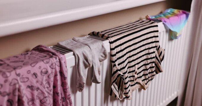 drying washed clothes on the radiator at home