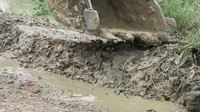 JCB Crane in Action - Digging and Digging Deep into the Mud