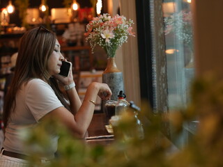 woman relax in cafe and use smartphone