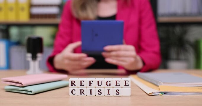 Engaging in discussion about the ongoing refugee crisis from an intimate workspace