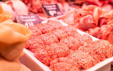 Raw sheep brains on counter of butcher shop