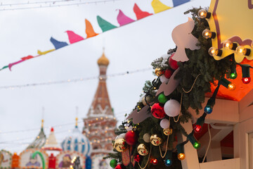 Christmas fair, winter bazaar with pine decor, night lights and festive fun.