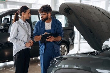 Technical inspection explained to customer indoors