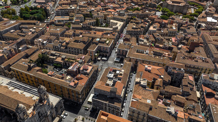 Aerial view of the streets between the buildings and houses of the historic center of Catania, Sicily, Italy. it is sunny day morning.