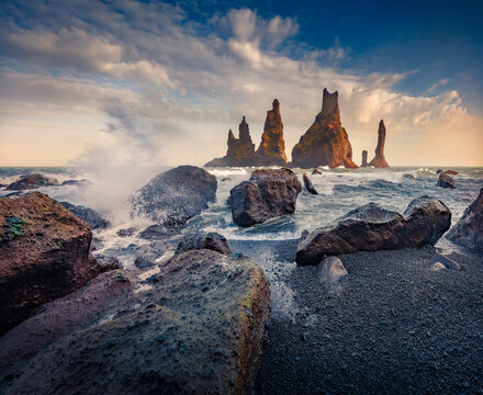 Exciting morning seascape of Atlantic ocean. Fabulous summer view of Reynisdrangar cliffs. Stormy wether in Iceland, Vik location, Europe. Beauty of nature concept background.