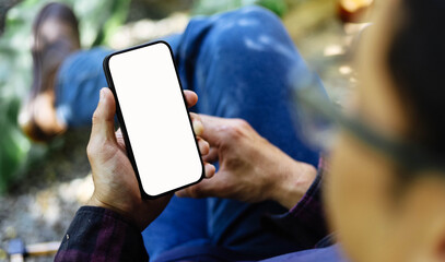 Mobile phone blank white screen mockup.texting using cell phone.background empty space for...