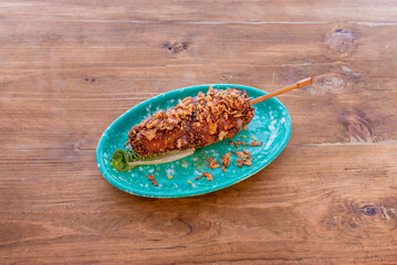 Korean hot dog with pork sausage, kimchi, pickled carrot,