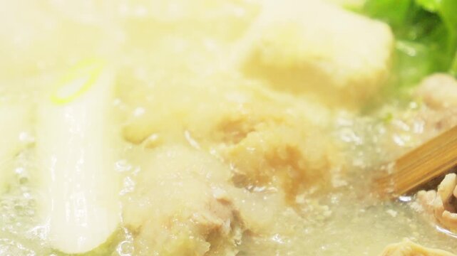 Hot pot filled with grated daikon radish, vegetables, meat, crab, and more&mdash;a winter gourmet delight