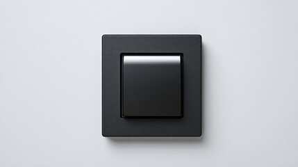 A modern black light switch is mounted on a plain white wall.