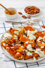 baked butternut squash with cheese, thyme, pecan