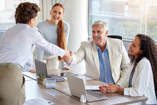 Happy business people, handshake and meeting with team for agreement, b2b or deal together at office. Businessman shaking hands with employee for greeting, introduction or partnership at workplace - Powered by Adobe