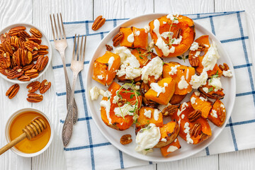 baked butternut squash with cheese, thyme, pecan