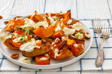 baked butternut squash with cheese, thyme, pecan