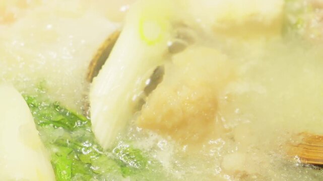 Hot pot filled with grated daikon radish, vegetables, meat, crab, and more&mdash;a winter gourmet delight