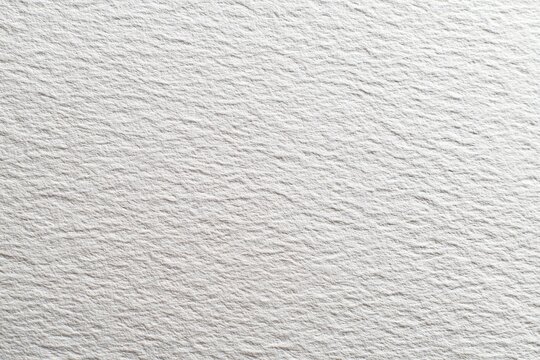 Close up of rough white watercolor paper surface grain.