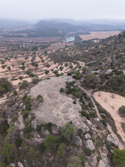 Obraz premium Aerial view from a drone of the Iberian settlement of El Cascarujo in the town of Alcañiz, in the Bajo Aragón region. Province of Teruel. Autonomous Community of Aragon. Spain. Europe