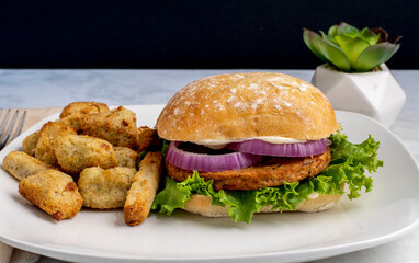 veggie burger  with veggie tots and fries