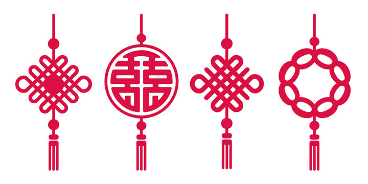 Traditional red chinese knot ornaments with symbolic designs and tassels for celebration