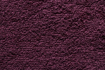 Close-up of a Soft, Plush, Deep Purple Textile with a Cozy, Textured Surface Pattern