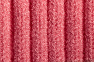 Macro Texture of Bright Pink Ribbed Knit or Corduroy Fabric