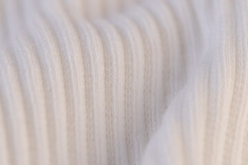Macro Texture of Ribbed Knit Fabric. Cloud Dancer 11-4201.