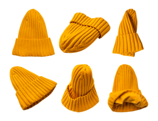 Warm knitted cotton yellow hat with a cuff isolated on white background. With clipping path. Cut-out wool winter hat, clothing collection for design, advertising, and mockups
