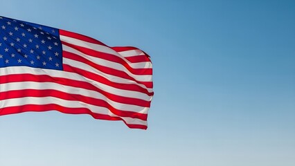 Fototapeta premium American Flag Waving in Sky