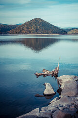 Transylvanian landscape with wonderful lake reflection. Reservoir of Zetea. Romania.