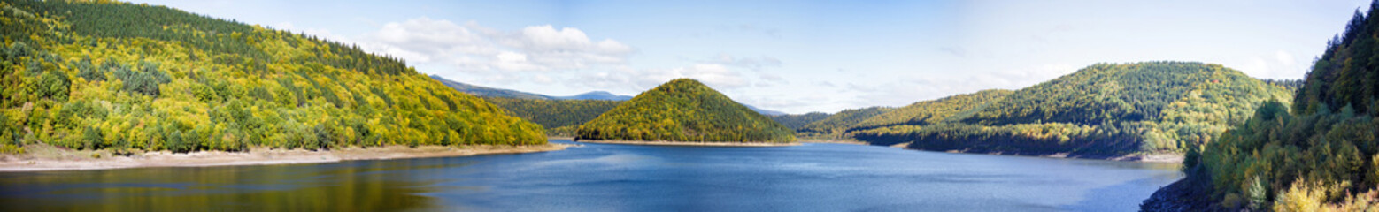 Reservoir of Zetea panorama in Transylvania. Peaceful Transylvanian landscape with wonderful lake reflection. Romania.