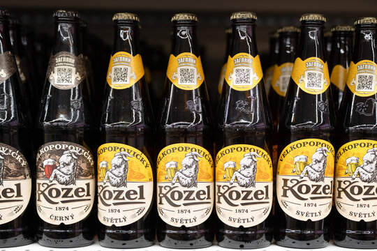 Vladikavkaz ,Russia - December 15 , 2025 : Kozel Czech Beer Bottles with Traditional Goat Logo and Velkopopovicky Brand Label Display in the Store