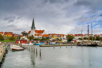 Fototapeta premium view of the historic waterfront in Ronne with the Lutheran church and the harbour and marina in the foreground