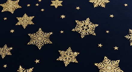 Close-up of many golden snowflake and star shapes on dark blue surface, creating festive and shiny appearance, symbolizing celebration, holidays, winter