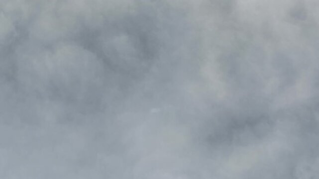 Aerial view of a thick blanket of grey clouds, creating an ethereal and dreamy atmosphere, Orschwiller, Grand Est, France.