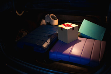 Christmas Gift and Suitcases in Car Trunk at Night, Holiday Journey Preparations