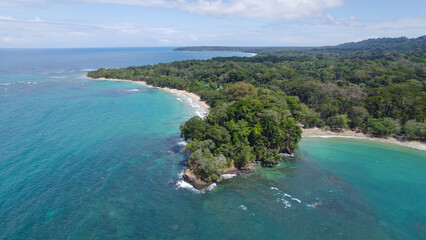 Naklejka premium Aerial View of Punta Uva Beach Surrounded by Lush Tropical Greenery, Costa Rica