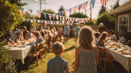 Children celebrating Fourth of July backyard party with family