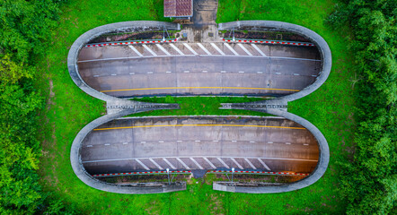 The tunnel for vehicles through the forest was built to connect the forest areas, allowing wildlife to cross back and forth.