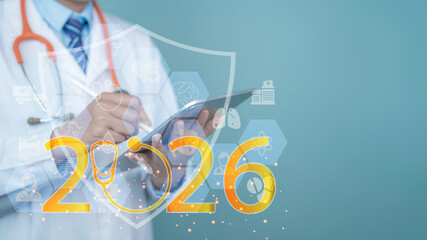 Doctor in white coat using digital tablet with stethoscope, healthcare icons and shield overlay, modern medical technology concept, health insurance protection 2026, copy space.