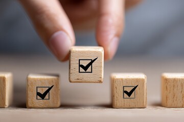 Hand placing wooden block with checkmark symbol on a row of blocks wooden blocks decision