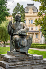 Statue of Bishop Anton Martin Slomsek by Martin Drev in front of Maribor Cathedral of Saint John the Baptist, on Slomskov Trg square, historic center of Maribor, Slovenia.