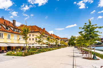View of the Lent district along the Drava River, historic riverside promenade and cultural heart of Maribor, Slovenia, known for wine heritage, old town architecture and relaxed daily life.