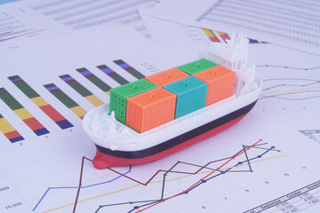 Cargo ship with containers on financial reports background. Sea ​​transportation management concept.	