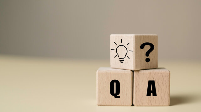 Wooden blocks with Q&A, question mark, and light bulb icon representing FAQ and problem-solving concept. Ideal for customer support, consulting, or educational content.