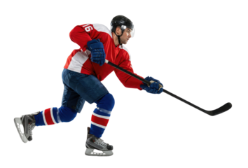 Ice hockey player in red jersey skating with stick on white background