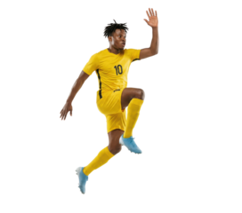 Soccer player in yellow uniform jumping isolated on white background