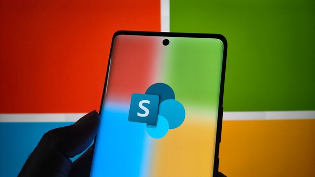Smartphone displaying microsoft sharepoint logo against colorful microsoft branding background