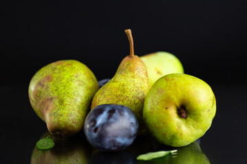 Natural fresh pears and plums in macro photography