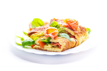 Egg omelet with salmon and spinach leaves for breakfast